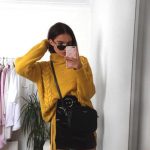 yellow-sweater-leather-skirt-outfit-cozy-new-years-eve-outfit-ideas-min