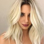 platinum-blonde-with-dark-roots-summer-hair-color-min