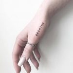 minimal-hand-tattoo-handwritten-design-tattoos